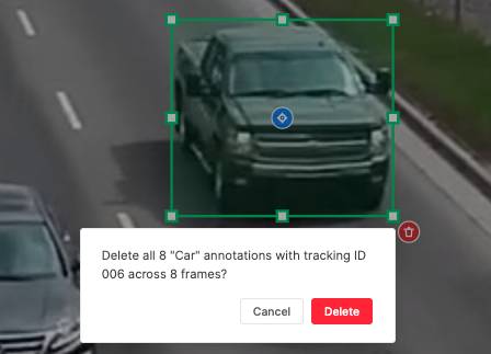 Selected bounding box with blue tracking icon at center and red trash icon at bottom-right; confirmation dialog showing deletion count