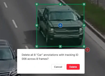 Selected bounding box with blue tracking icon at center and red trash icon at bottom-right; confirmation dialog showing deletion count